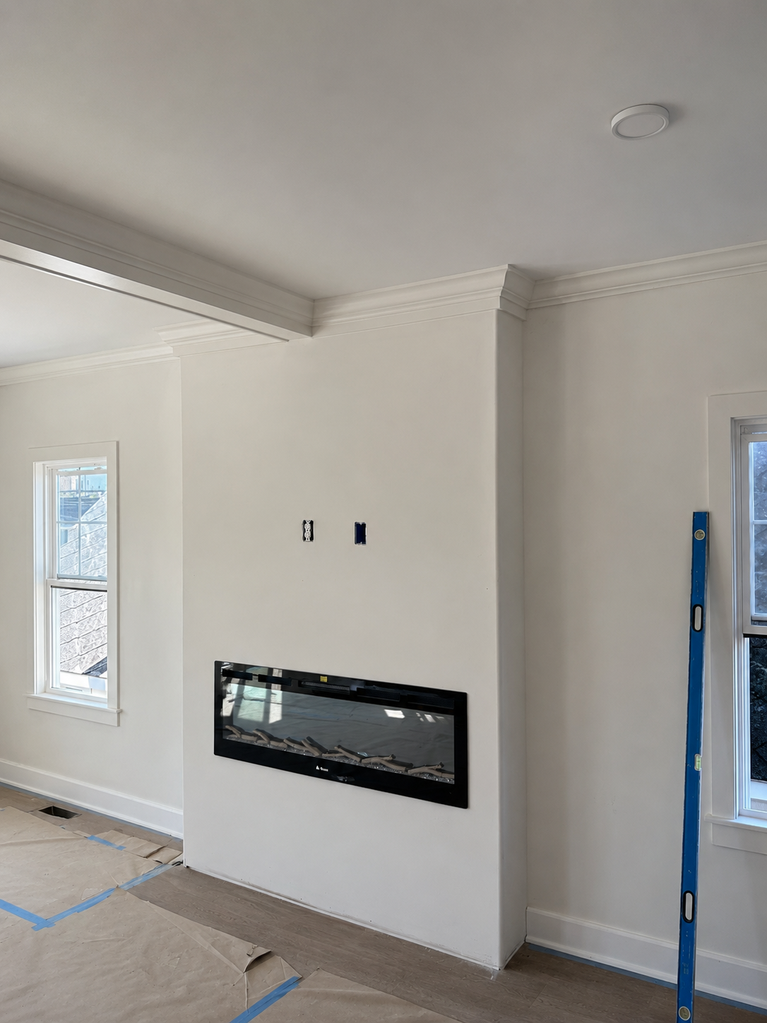 Fireplace wall before vertical slat feature installation